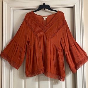 Beautiful Rust colored, flowing blouse